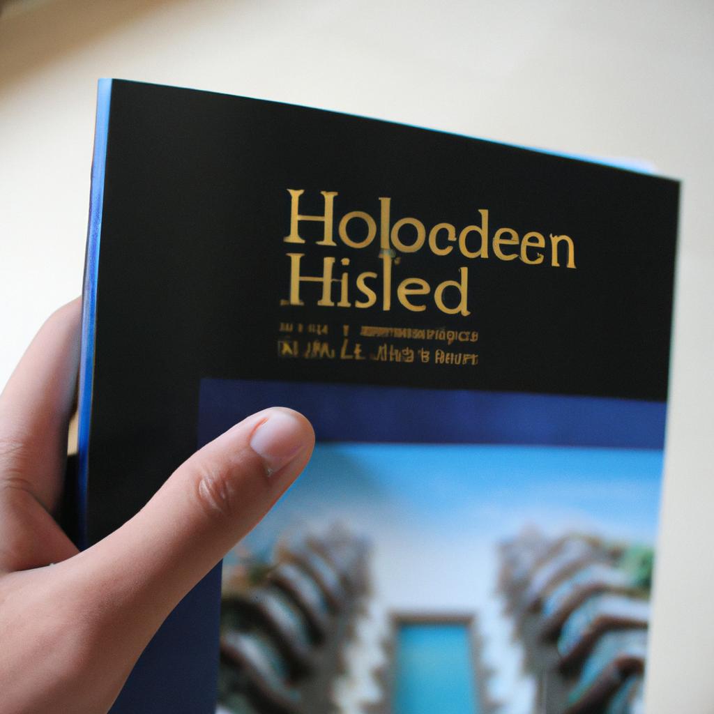 Person holding hotel directory brochure